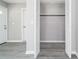 Spacious closet featuring shelving, luxury vinyl plank flooring, and louvered doors at 665 S Eugenia Nw Pl, Atlanta, GA 30318