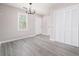 Dining area featuring a chandelier, louvered closet, and luxury vinyl plank flooring at 665 S Eugenia Nw Pl, Atlanta, GA 30318
