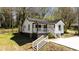 Charming renovated home with white siding, black trim, and inviting front porch at 665 S Eugenia Nw Pl, Atlanta, GA 30318