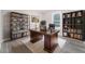 Home office with modern desk, bookshelves, and luxury vinyl plank flooring at 665 S Eugenia Nw Pl, Atlanta, GA 30318