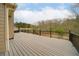 Expansive back deck with black metal railing is perfect for entertaining and outdoor living at 830 Buffington Way, Canton, GA 30115
