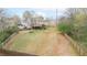 Expansive backyard featuring a well-maintained lawn and mature trees with privacy fence at 830 Buffington Way, Canton, GA 30115
