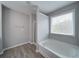 A bright bathroom with a soaking tub next to a window and separate shower at 830 Buffington Way, Canton, GA 30115
