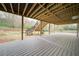 Expansive covered deck featuring stairs to the backyard and ample space for outdoor gatherings and relaxation at 830 Buffington Way, Canton, GA 30115