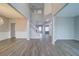 Open-concept foyer with soaring ceilings and new light gray vinyl flooring at 830 Buffington Way, Canton, GA 30115