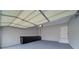 Clean garage with built in cabinets, coated floor, and automatic door at 830 Buffington Way, Canton, GA 30115