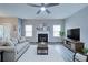 Comfortable living room with fireplace, modern decor, and new light gray vinyl flooring at 830 Buffington Way, Canton, GA 30115