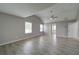 Spacious main bedroom with vaulted ceiling, ceiling fan, and new light gray vinyl flooring at 830 Buffington Way, Canton, GA 30115