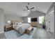 Serene main bedroom featuring a vaulted ceiling, a ceiling fan, and a sitting area with neutral décor at 830 Buffington Way, Canton, GA 30115