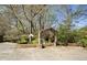 Unique backyard featuring a stone archway, garden, and statue, enhancing outdoor space at 1716 Rogers Sw Ave, Atlanta, GA 30310