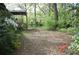 Spacious backyard with mature trees and lots of green space and foliage at 1716 Rogers Sw Ave, Atlanta, GA 30310