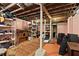 Spacious basement with exposed ceiling and support beams, ample storage space, and concrete flooring at 1716 Rogers Sw Ave, Atlanta, GA 30310