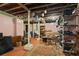 Spacious basement with exposed ceiling and support beams, ample storage space, and concrete flooring at 1716 Rogers Sw Ave, Atlanta, GA 30310