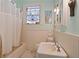 Charming bathroom features a bathtub with white tiling, decor, and fixtures at 1716 Rogers Sw Ave, Atlanta, GA 30310