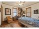Bright bedroom with wood floors, natural light, ceiling fan and comfortable furnishings at 1716 Rogers Sw Ave, Atlanta, GA 30310