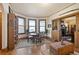 Bright dining room with a bay window, hardwood floors, and adjacent living area at 1716 Rogers Sw Ave, Atlanta, GA 30310