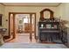 Inviting entryway featuring hardwood floors, wooden pillars, and a vintage piano at 1716 Rogers Sw Ave, Atlanta, GA 30310