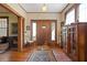 Grand entryway with hardwood floors, a vintage rug, and a view into other rooms at 1716 Rogers Sw Ave, Atlanta, GA 30310