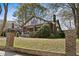 Beautiful two-story home with brick and stone accents and mature trees at 1716 Rogers Sw Ave, Atlanta, GA 30310