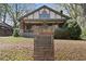 Historic marker in the front yard of this charming two-story home with mature trees at 1716 Rogers Sw Ave, Atlanta, GA 30310