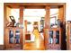 Hallway with original wood trim, hardwood floors, and built-in cabinets for storage at 1716 Rogers Sw Ave, Atlanta, GA 30310