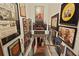 Hallway with walls covered in artwork and posters, leading to stairs at 1716 Rogers Sw Ave, Atlanta, GA 30310
