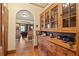 Hallway with built-in wooden cabinets, hardwood floors, and open sightlines into living spaces at 1716 Rogers Sw Ave, Atlanta, GA 30310