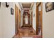 Hallway with hardwood floors, high ceilings, and decorative mirror at 1716 Rogers Sw Ave, Atlanta, GA 30310