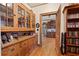 Charming hallway featuring wood cabinets, hardwood floors, and views into other rooms at 1716 Rogers Sw Ave, Atlanta, GA 30310