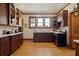 Well-lit kitchen with hardwood floors, wooden cabinets, and contrasting countertops at 1716 Rogers Sw Ave, Atlanta, GA 30310