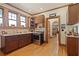 Kitchen featuring wooden cabinets, stainless steel appliances, and hardwood floors at 1716 Rogers Sw Ave, Atlanta, GA 30310