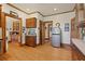 Traditional kitchen with wood trim, wood floors, stainless refrigerator, and custom wood cabinets at 1716 Rogers Sw Ave, Atlanta, GA 30310