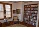 Cozy reading nook featuring a bookshelf and a comfortable chair next to a bright window at 1716 Rogers Sw Ave, Atlanta, GA 30310