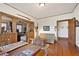 Cozy living room with wood floors, wood trim, furniture, and decor throughout at 1716 Rogers Sw Ave, Atlanta, GA 30310