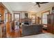 Cozy living room featuring a brick fireplace, hardwood floors, and traditional wooden accents at 1716 Rogers Sw Ave, Atlanta, GA 30310