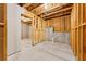 Unfinished basement featuring exposed beams and concrete foundation walls at 3218 Garden Hill Ln, Douglasville, GA 30135