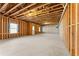 Unfinished basement featuring exposed beams and concrete foundation walls at 3218 Garden Hill Ln, Douglasville, GA 30135
