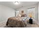 Comfortable bedroom featuring plush bedding, soft carpeting, and ample natural light at 3218 Garden Hill Ln, Douglasville, GA 30135