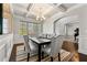 Spacious dining room showcasing a coffered ceiling, hardwood floors, and direct access to the foyer and living room at 3218 Garden Hill Ln, Douglasville, GA 30135