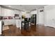 Bright kitchen with white cabinets, hardwood flooring, and stainless steel appliances at 3218 Garden Hill Ln, Douglasville, GA 30135