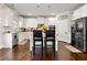 Modern kitchen featuring white cabinetry, stainless steel appliances, and center island at 3218 Garden Hill Ln, Douglasville, GA 30135