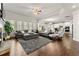 Open-concept living room with large windows, hardwood floors, and contemporary decor at 3218 Garden Hill Ln, Douglasville, GA 30135