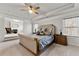 Serene main bedroom featuring a tray ceiling, sitting area, and plush carpeting at 3218 Garden Hill Ln, Douglasville, GA 30135