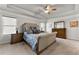 Spacious main bedroom features a tray ceiling, neutral walls, and an elegant headboard at 3218 Garden Hill Ln, Douglasville, GA 30135