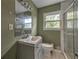 Bathroom features a single sink vanity, toilet, and a glass-enclosed shower at 3540 Victoria St, Atlanta, GA 30337