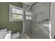 Bathroom features a glass-enclosed shower with white marble-look tile and built-in shelving at 3540 Victoria St, Atlanta, GA 30337