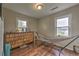 Bedroom with wood floors features a decorative cabinet and hammock at 3540 Victoria St, Atlanta, GA 30337