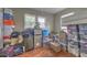 Bedroom piled with boxes and storage containers features wood floor at 3540 Victoria St, Atlanta, GA 30337