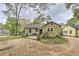 Cozy single-story home with a quaint patio and an expansive dirt yard, perfect for outdoor activities at 3540 Victoria St, Atlanta, GA 30337