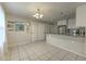 Eat-in kitchen with white cabinets, granite countertops, and tile flooring at 3540 Victoria St, Atlanta, GA 30337